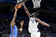 Dallas Mavericks center Moussa Cisse (30) blocks a shot by Oklahoma City Thunder guard...