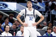 Dallas Mavericks forward Cooper Flagg (32) reacts after being called for a second half...