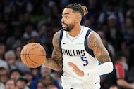 Dallas Mavericks guard D'Angelo Russell (5) brings the ball up the court during the first...