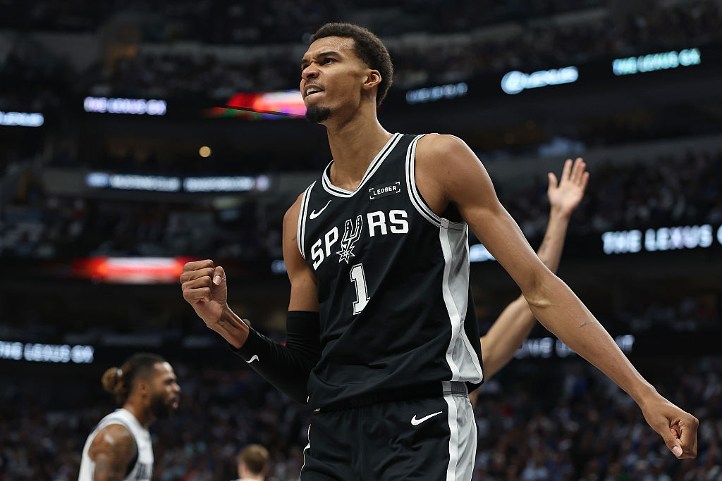 DALLAS, TEXAS - OCTOBER 22: Victor Wembanyama #1 of the San Antonio Spurs reacts to an officials call during the first half against the Dallas Mavericks at American Airlines Center on October 22, 2025 in Dallas, Texas. NOTE TO USER: User expressly acknowledges and agrees that, by downloading and or using this photograph, User is consenting to the terms and conditions of the Getty Images License Agreement. (Photo by Stacy Revere/Getty Images)