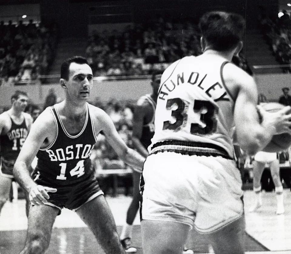 Feb 22, 1961; Los Angeles, CA, USA; FILE PHOTO; Boston Celtics guard Bob Cousy (14) defends Los Angeles Lakers guard Rod Hundley (33) at the Forum. Mandatory Credit: Darryl Norenberg-USA TODAY Sports