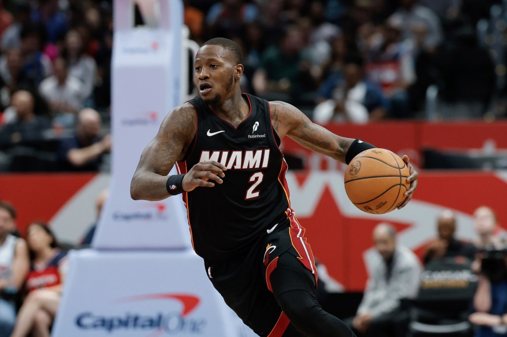 Miami Heat guard Terry Rozier (2) brings the ball up court during the second half of an NBA basketball game against the Washington Wizards in Washington, Monday, March 31, 2025. 