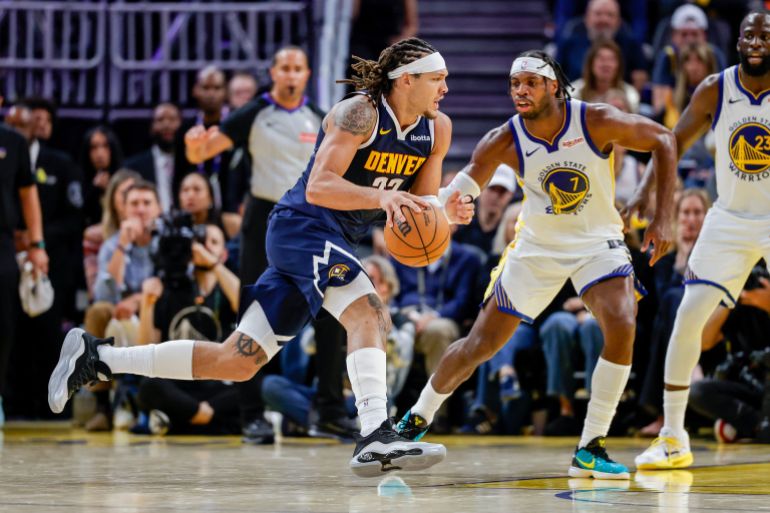Denver Nuggets forward Aaron Gordon (32) drives on Golden State Warriors guard Buddy Hield (7) during the fourth quarter at Chase Center