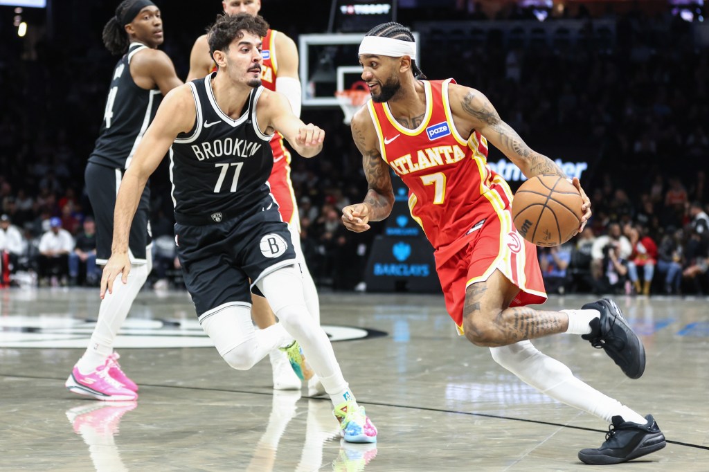 Atlanta Hawks guard Nickeil Alexander-Walker (7) drives past Brooklyn Nets guard Ben Saraf (77) in the third quarter at Barclays Center.