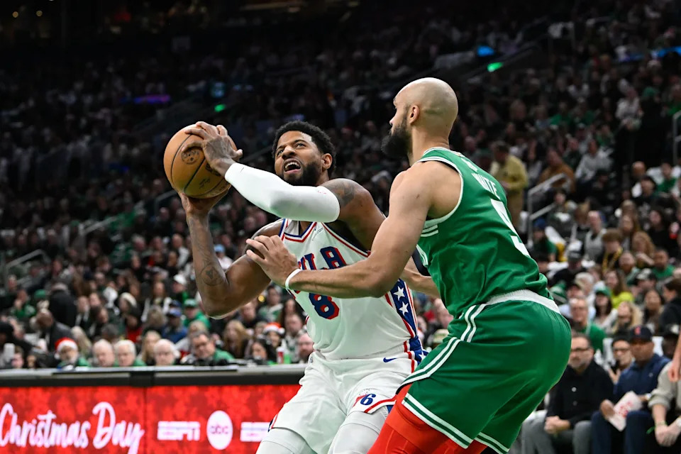 Dec 25, 2024; Boston, Massachusetts, USA; Philadelphia 76ers forward Paul George (8) looks to shoot the ball against Boston Celtics guard Derrick White (9) during the first half at TD Garden. Mandatory Credit: Eric Canha-Imagn Images