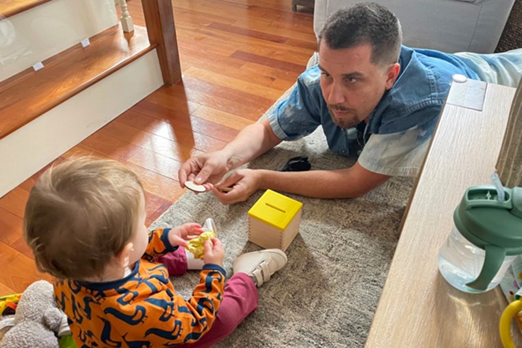 Eli Robinson plays with his niece.
