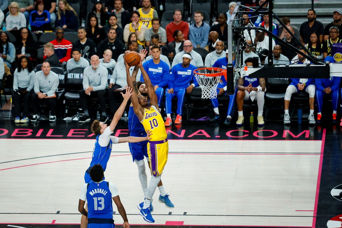 Los Angeles center Christian Koloko (10) catches a lob during a NBA preseason game between the Los Angeles Lakers and the Dallas Mavericks, Wednesday October 15, 2025 in Las Vegas, Nev. Los Angeles center Christian Koloko (10) catches a lob during a NBA preseason game between the Los Angeles Lakers and the Dallas Mavericks, Wednesday October 15, 2025 in Las Vegas, Nev.