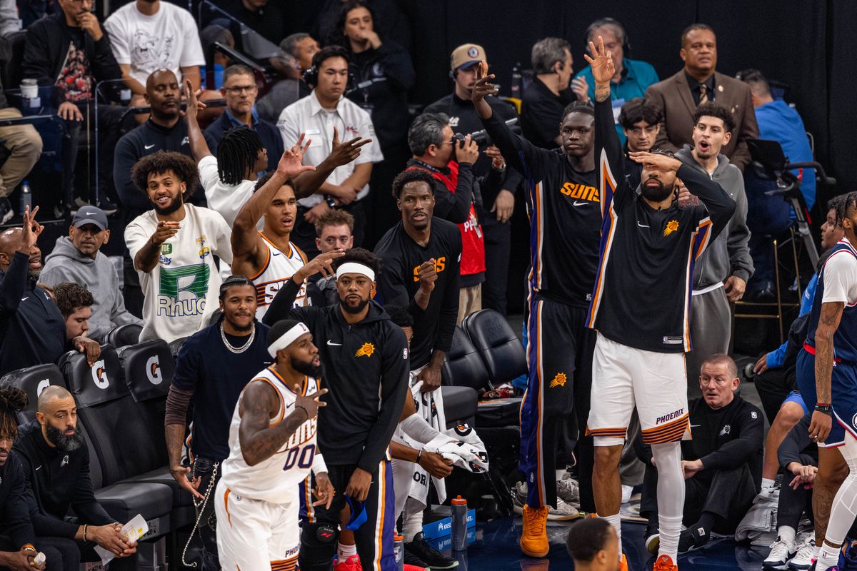 The Phoenix Suns bench celebrates a three point shot by forward Royce O'Neale #00 of the Phoenix Suns during an NBA game against the LA Clippers at the Intuit Dome on October 24, 2025 in Inglewood California.