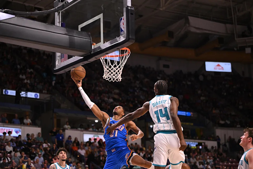 Oct 5, 2025; North Charleston, South Carolina, USA; Oklahoma City Thunder guard Aaron Wiggins (21) tosses up a shot against the Charlotte Hornets in the first quarter at North Charleston Coliseum. Mandatory Credit: Arthur Ellis-Imagn Images