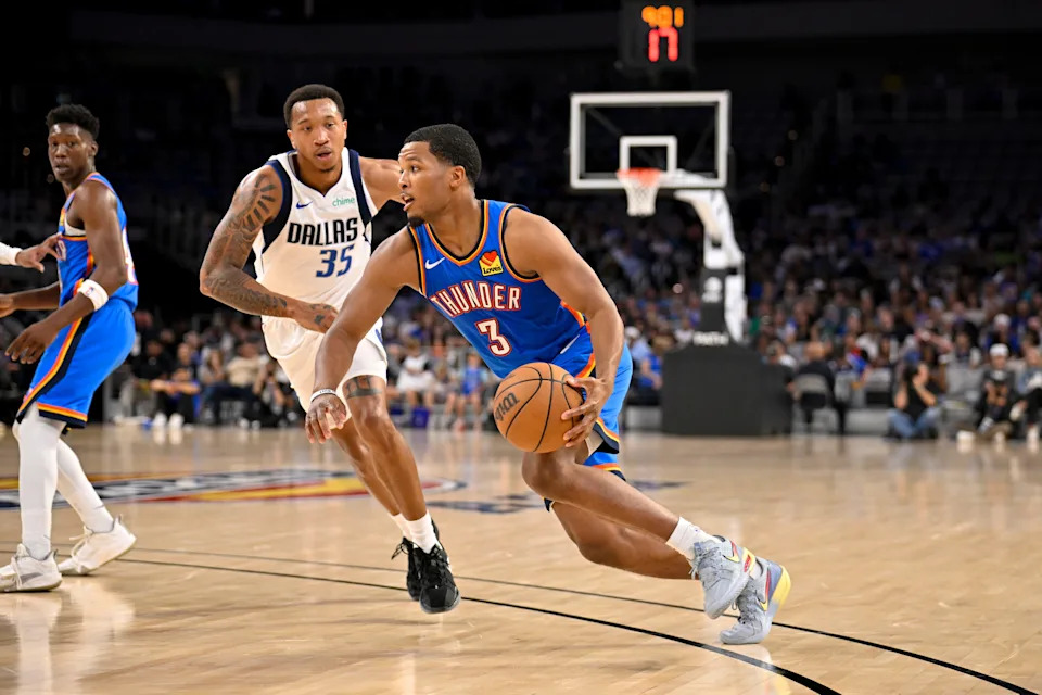 Oct 6, 2025; Fort Worth, Texas, USA; Oklahoma City Thunder guard Chris Youngblood (3) looks to move the ball past Dallas Mavericks guard Matthew Cleveland (35) during the second half at Dickie's Arena. Mandatory Credit: Jerome Miron-Imagn Images