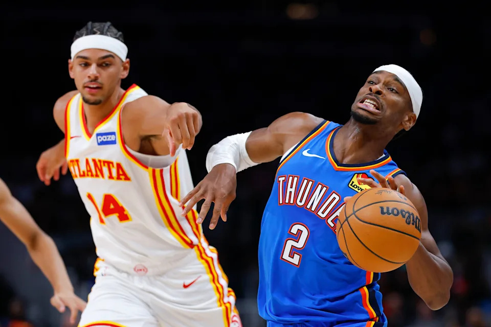 ATLANTA, GEORGIA - OCTOBER 25: Shai Gilgeous-Alexander #2 of the Oklahoma City Thunder is fouled by Asa Newell #14 of the Atlanta Hawks during the third quarter at State Farm Arena on October 25, 2025 in Atlanta, Georgia. NOTE TO USER: User expressly acknowledges and agrees that, by downloading and or using this photograph, User is consenting to the terms and conditions of the Getty Images License Agreement. (Photo by Todd Kirkland/Getty Images)