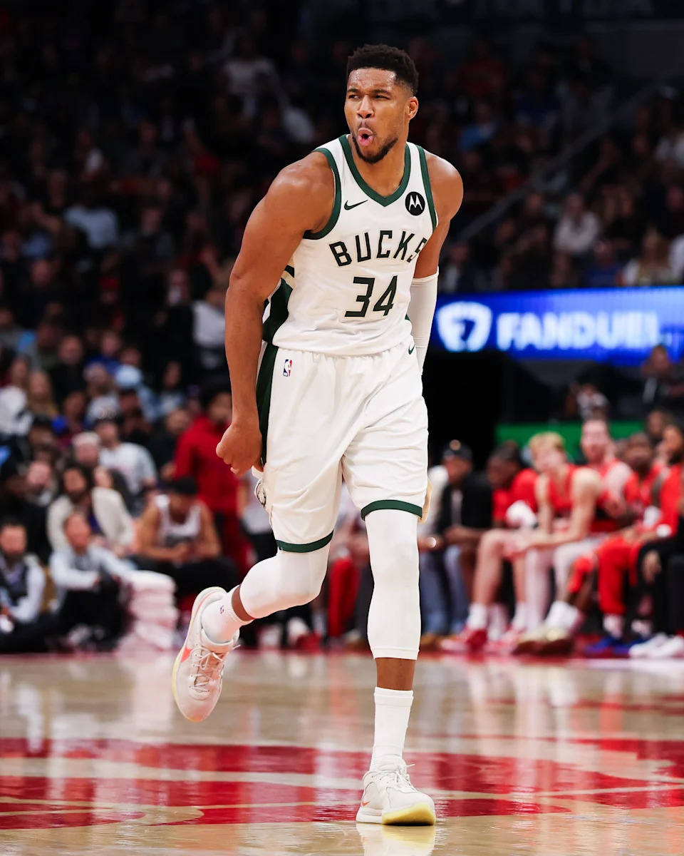 Giannis Antetokounmpo reacts after hitting a 3-point basket against the Toronto Raptors during the second half at Scotiabank Arena.