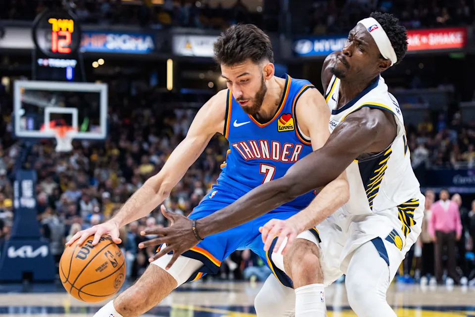 Oct 23, 2025; Indianapolis, Indiana, USA; Oklahoma City Thunder center Chet Holmgren (7) dribbles the ball while Indiana Pacers forward Pascal Siakam (43) defends in the second half at Gainbridge Fieldhouse. Mandatory Credit: Trevor Ruszkowski-Imagn Images