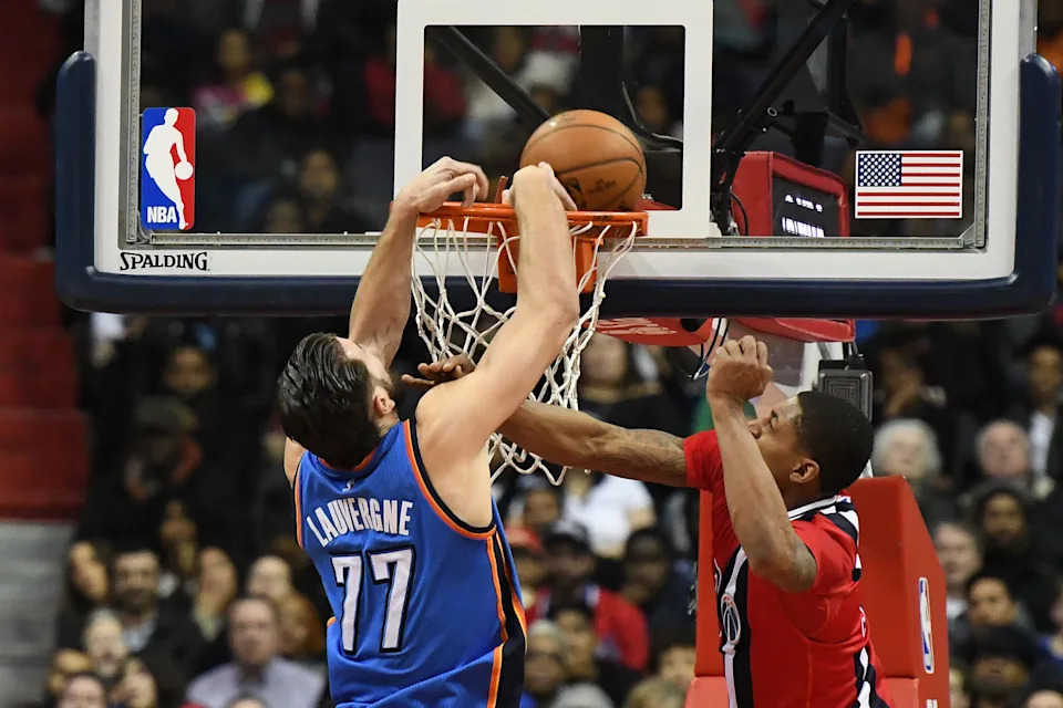 Feb 13, 2017; Washington, DC, USA; Washington Wizards guard Bradley Beal (3) fouls Oklahoma City Thunder center Joffrey Lauvergne (77) on his dunk attempt during the second half at Verizon Center. Washington Wizards defeated Oklahoma City Thunder 120-98. Mandatory Credit: Tommy Gilligan-USA TODAY Sports
