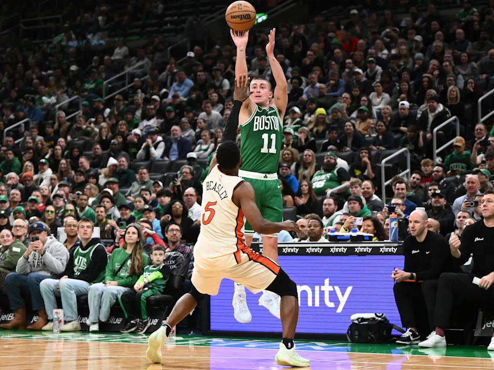 Dec 4, 2024; Boston, Massachusetts, USA; Boston Celtics guard Payton Pritchard (11) attempts a free through against Detroit Pistons guard Malik Beasley (5) during the fourth quarter at the TD Garden. Mandatory Credit: Brian Fluharty-Imagn Images