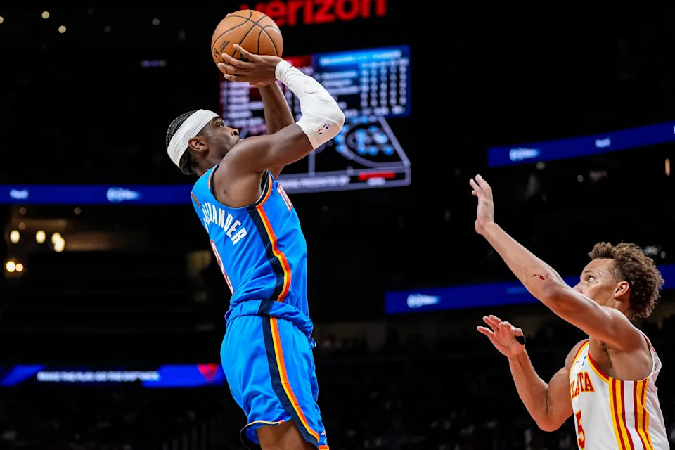 Oct 25, 2025; Atlanta, Georgia, USA; Oklahoma City Thunder guard Shai Gilgeous-Alexander (2) shoots over Atlanta Hawks guard Dyson Daniels (5) during the second half at State Farm Arena. Mandatory Credit: Dale Zanine-Imagn Images