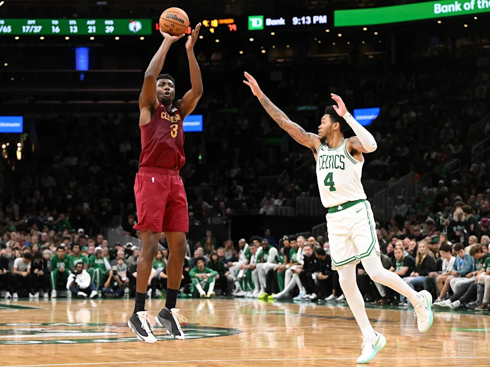 Oct 12, 2025; Boston, Massachusetts, USA; Cleveland Cavaliers center/forward Thomas Bryant (3) attempts a basket against Boston Celtics guard Anfernee Simons (4) during the second half at TD Garden. Mandatory Credit: Brian Fluharty-Imagn Images