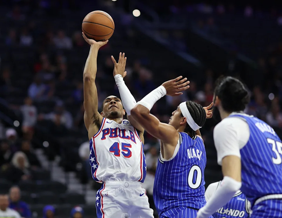Oct 10, 2025; Philadelphia, Pennsylvania, USA; Philadelphia 76ers guard Hunter Sallis (45) drives for a shot against Orlando Magic guard Anthony Black (0) during the second quarter at Xfinity Mobile Arena. Mandatory Credit: Bill Streicher-Imagn Images