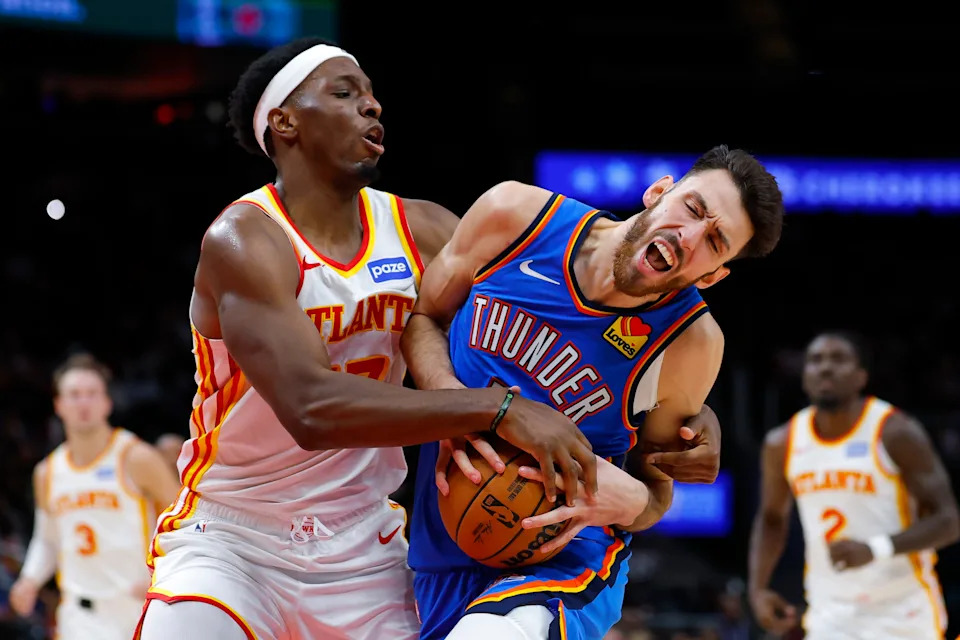 ATLANTA, GEORGIA - OCTOBER 25: Chet Holmgren #7 of the Oklahoma City Thunder is fouled by Onyeka Okongwu #17 of the Atlanta Hawks during the fourth quarter at State Farm Arena on October 25, 2025 in Atlanta, Georgia. NOTE TO USER: User expressly acknowledges and agrees that, by downloading and or using this photograph, User is consenting to the terms and conditions of the Getty Images License Agreement. (Photo by Todd Kirkland/Getty Images)
