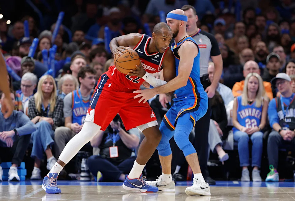 Oct 30, 2025; Oklahoma City, Oklahoma, USA; Washington Wizards forward Khris Middleton (22) drives against Oklahoma City Thunder guard Alex Caruso (9) during the second half at Paycom Center. Mandatory Credit: Alonzo Adams-Imagn Images