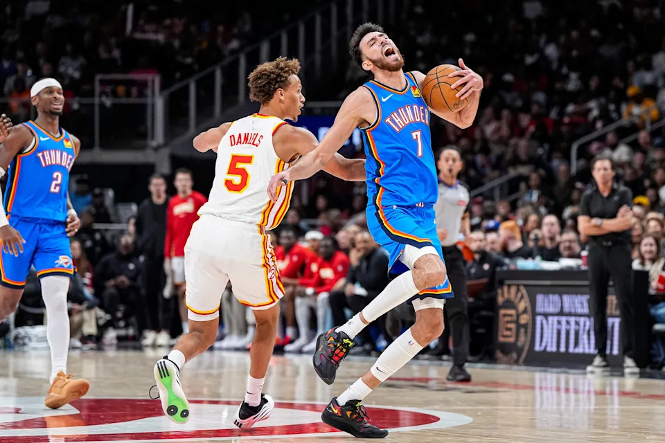 Oct 25, 2025; Atlanta, Georgia, USA; Oklahoma City Thunder center Chet Holmgren (7) is fouled by Atlanta Hawks guard Dyson Daniels (5) during the second half at State Farm Arena. Mandatory Credit: Dale Zanine-Imagn Images