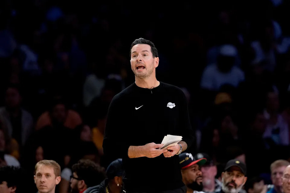 Lakers coach JJ Redick instructs players from the sideline during the second half Friday.