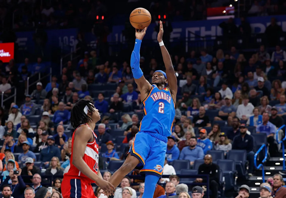 Oct 30, 2025; Oklahoma City, Oklahoma, USA; Oklahoma City Thunder guard Shai Gilgeous-Alexander (2) shoots over Washington Wizards guard Tre Johnson (12) during the second half at Paycom Center. Mandatory Credit: Alonzo Adams-Imagn Images