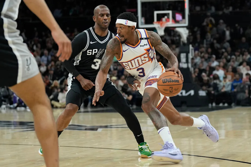 Feb 20, 2025; Austin, Texas, USA; Phoenix Suns guard Bradley Beal (3) drives to the basket against San Antonio Spurs guard Chris Paul (3) during the first half of the San Antonio Spurs at Moody Center. Mandatory Credit: Scott Wachter-Imagn ImagesCredit&colon; Scott Wachter-Imagn Images