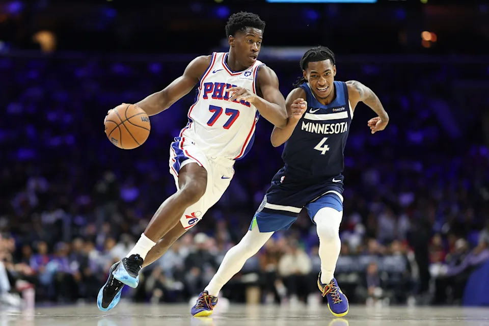 Oct 17, 2025; Philadelphia, Pennsylvania, USA; Philadelphia 76ers guard Vj Edgecombe (77) dribbles past Minnesota Timberwolves guard Rob Dillingham (4) during the third quarter at Xfinity Mobile Arena. Mandatory Credit: Bill Streicher-Imagn Images