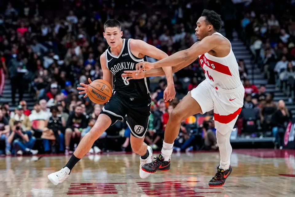 Brooklyn Nets guard Egor Dëmin (8) dribbles the ball against Toronto Raptors forward/guard Scottie Barnes (4) during the second quarter at Scotiabank Arena. IMAGN IMAGES via Reuters Connect