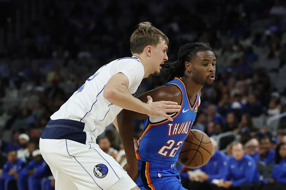 FORT WORTH, TEXAS - OCTOBER 06: Cason Wallace #22 of the Oklahoma City Thunder is defended by Cooper Flagg #32 of the Dallas Mavericks during the first half of a preseason game at Dickies Arena on October 06, 2025 in Fort Worth, Texas. NOTE TO USER: User expressly acknowledges and agrees that, by downloading and or using this photograph, User is consenting to the terms and conditions of the Getty Images License Agreement. (Photo by Stacy Revere/Getty Images)
