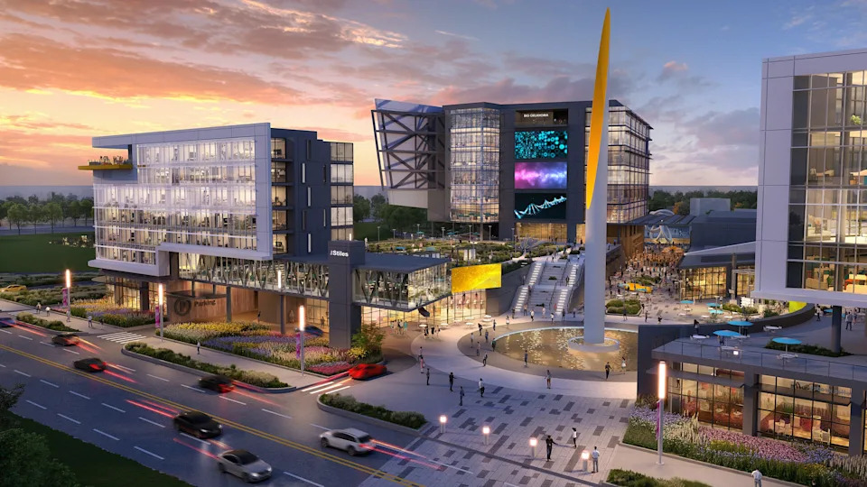 The original designs for Convergence, shown in these renderings provided in 2021, included a vibrant public space and colorful and angled building facades.