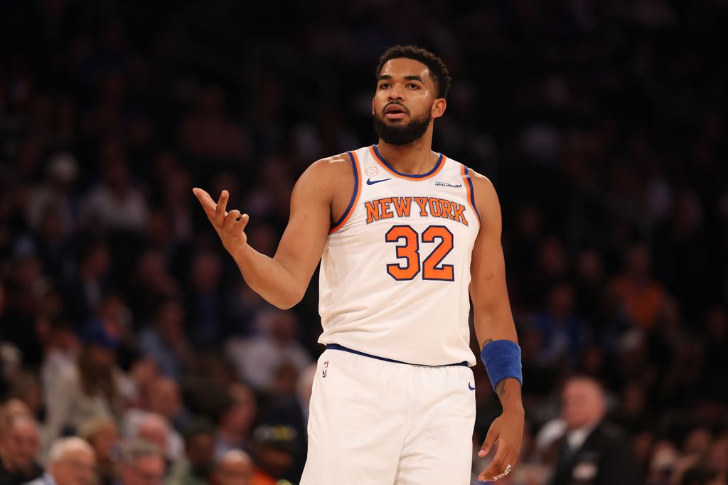 Karl-Anthony Towns #32 of the New York Knicks reacts after scoring a three point basket