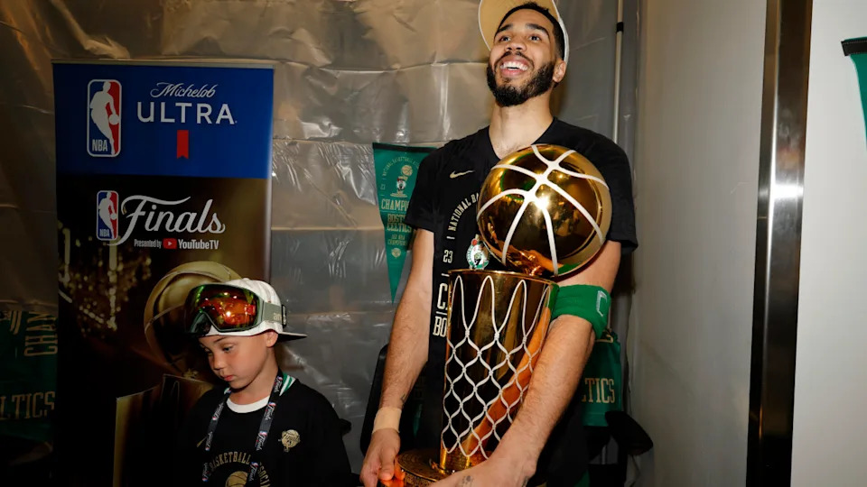 Jayson Tatum and son Deuce after the 2024 NBA FinalsDanielle Parhizkaran&sol;The Boston Globe via Getty Images