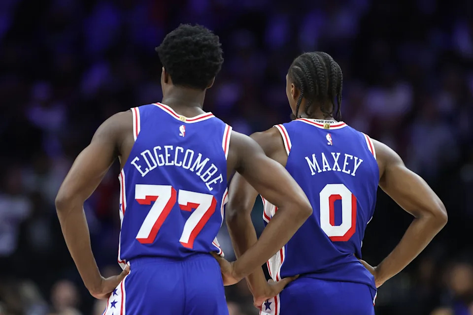 Oct 25, 2025; Philadelphia, Pennsylvania, USA; Philadelphia 76ers guard VJ Edgecombe (77) and guard Tyrese Maxey (0) look on during the third quarter against the Charlotte Hornets at Xfinity Mobile Arena. Mandatory Credit: Bill Streicher-Imagn Images