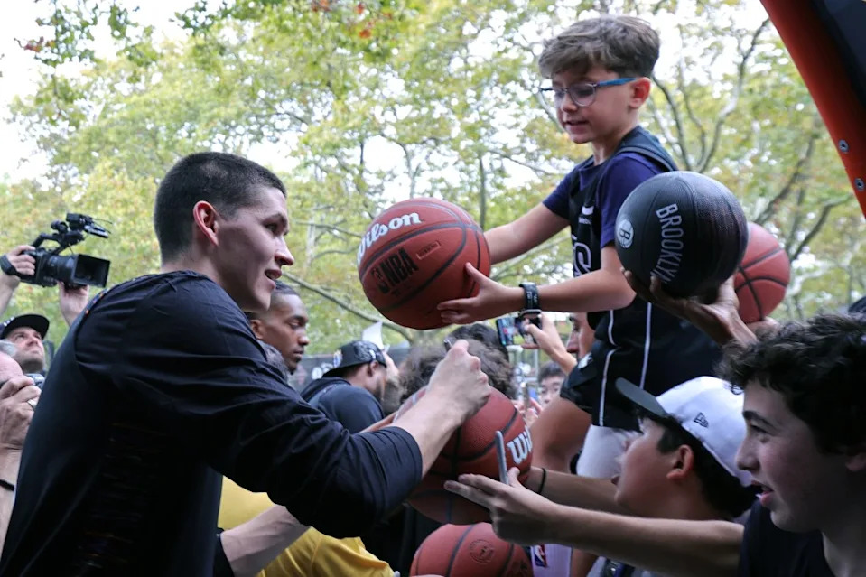 Egor Demin #8 of the Brooklyn Nets signs autographs on September 28, 2025. NBAE via Getty Images