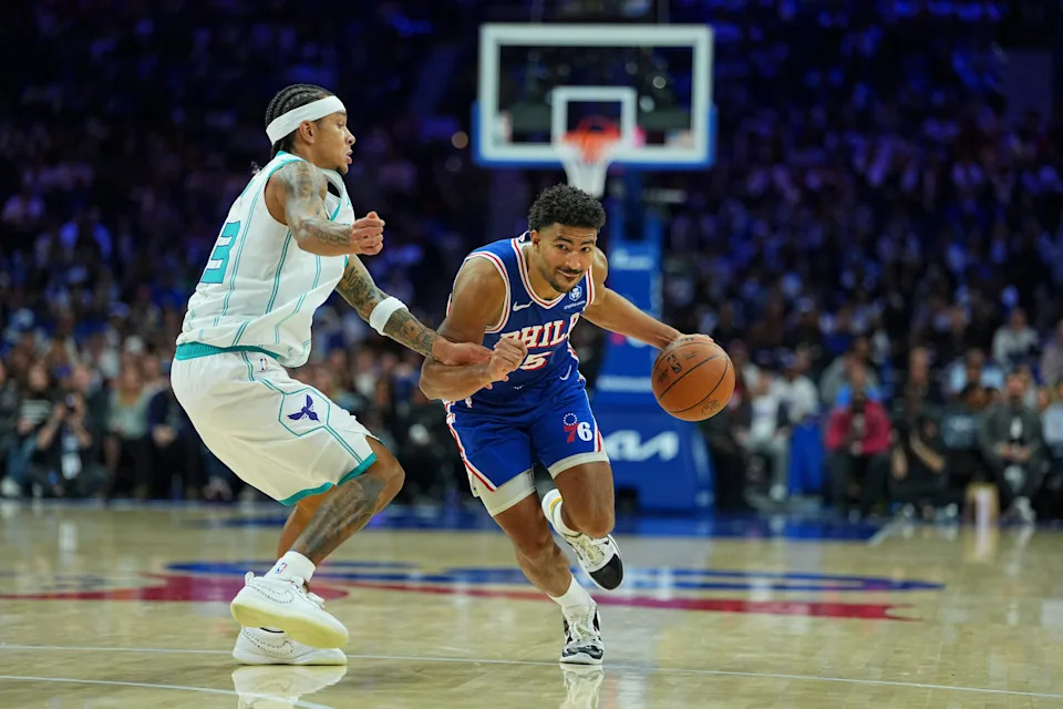 PHILADELPHIA, PENNSYLVANIA - OCTOBER 25: Quentin Grimes #5 of the Philadelphia 76ers dribbles the ball against Tre Mann #23 of the Charlotte Hornets in the second half at Xfinity Mobile Arena on October 25, 2025 in Philadelphia, Pennsylvania. The 76ers defeated the Hornets 125-121. NOTE TO USER: User expressly acknowledges and agrees that, by downloading and or using this photograph, User is consenting to the terms and conditions of the Getty Images License Agreement. (Photo by Mitchell Leff/Getty Images)