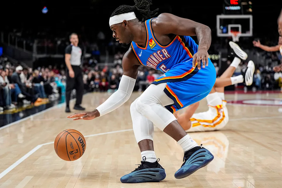 Oct 25, 2025; Atlanta, Georgia, USA; Oklahoma City Thunder guard Luguentz Dort (5) controls the ball against the Atlanta Hawks during the first half at State Farm Arena. Mandatory Credit: Dale Zanine-Imagn Images