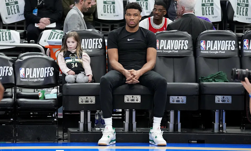 Injured Milwaukee Bucks forward Giannis Antetokounmpo watches his team warm up before their game against the Miami Heat Wednesday, April 19, 2023 at Fiserv Forum in Milwaukee, Wis.