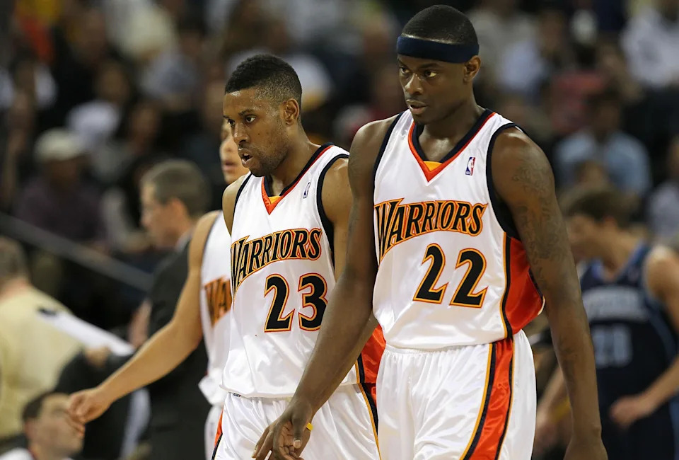 OAKLAND, CA - FEBRUARY 19: Anthony Morrow #22 and C.J. Watson #23 of the Golden State Warriors look on against the Utah Jazz during an NBA game at Oracle Arena at Oracle Arena on February 19, 2010 in Oakland, California. NOTE TO USER: User expressly acknowledges and agrees that, by downloading and/or using this Photograph, user is consenting to the terms and conditions of the Getty Images License Agreement. (Photo by Jed Jacobsohn/Getty Images)