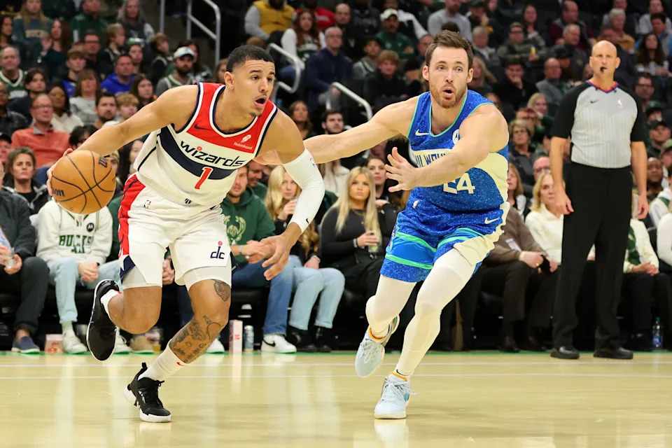 Johnny Davis of the Washington Wizards drives around Pat Connaughton of the Milwaukee Bucks during an In-Season Tournament game at Fiserv Forum on Nov. 24, 2023.
