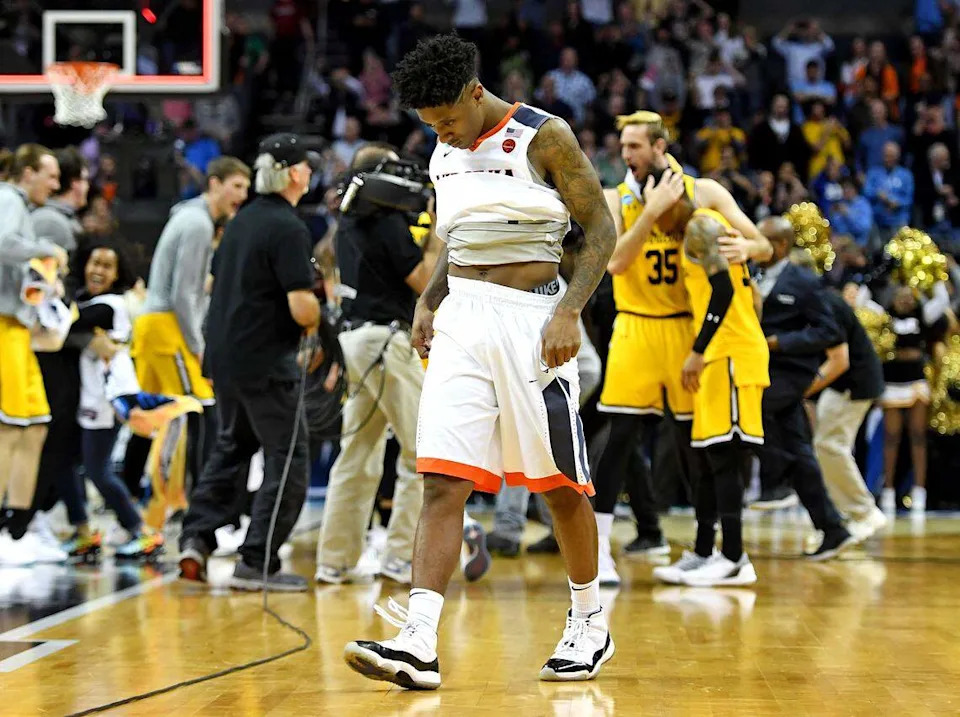 March 16, 2018: Virginia guard Nigel Johnson (23) reacts after an upset loss to the UMBC Retrievers in the first round of the NCAA Tournament at Spectrum Center in Charlotte. With the defeat, Virginia became the first No. 1 seed to lose to a No. 16 seed in the NCAA men's tournament.