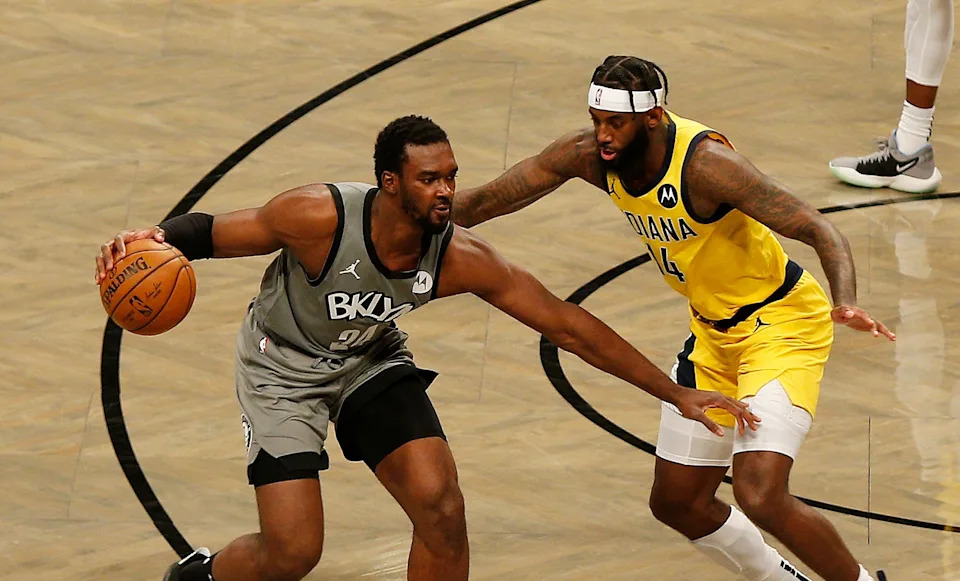 Feb 10, 2021; Brooklyn, New York, USA; Brooklyn Nets guard Noah Vonleh (24) dribbles against Indiana Pacers forward JaKarr Sampson (14) during the second half at Barclays Center. Mandatory Credit: Andy Marlin-USA TODAY Sports