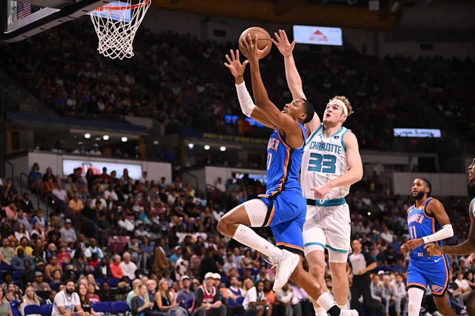 Oct 5, 2025; North Charleston, South Carolina, USA; Oklahoma City Thunder guard Aaron Wiggins (21) drives the basket against the Charlotte Hornets at North Charleston Coliseum. Mandatory Credit: Arthur Ellis-Imagn Images