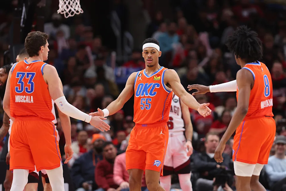 CHICAGO, ILLINOIS - JANUARY 13: Darius Bazley #55 of the Oklahoma City Thunder high fives Mike Muscala #33 and Jalen Williams #8 against the Chicago Bulls during the first half at United Center on January 13, 2023 in Chicago, Illinois. NOTE TO USER: User expressly acknowledges and agrees that, by downloading and or using this photograph, User is consenting to the terms and conditions of the Getty Images License Agreement. (Photo by Michael Reaves/Getty Images)