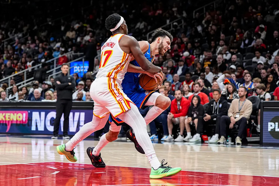 Oct 25, 2025; Atlanta, Georgia, USA; Oklahoma City Thunder center Chet Holmgren (7) is fouled by Atlanta Hawks forward Onyeka Okongwu (17) during the second half at State Farm Arena. Mandatory Credit: Dale Zanine-Imagn Images