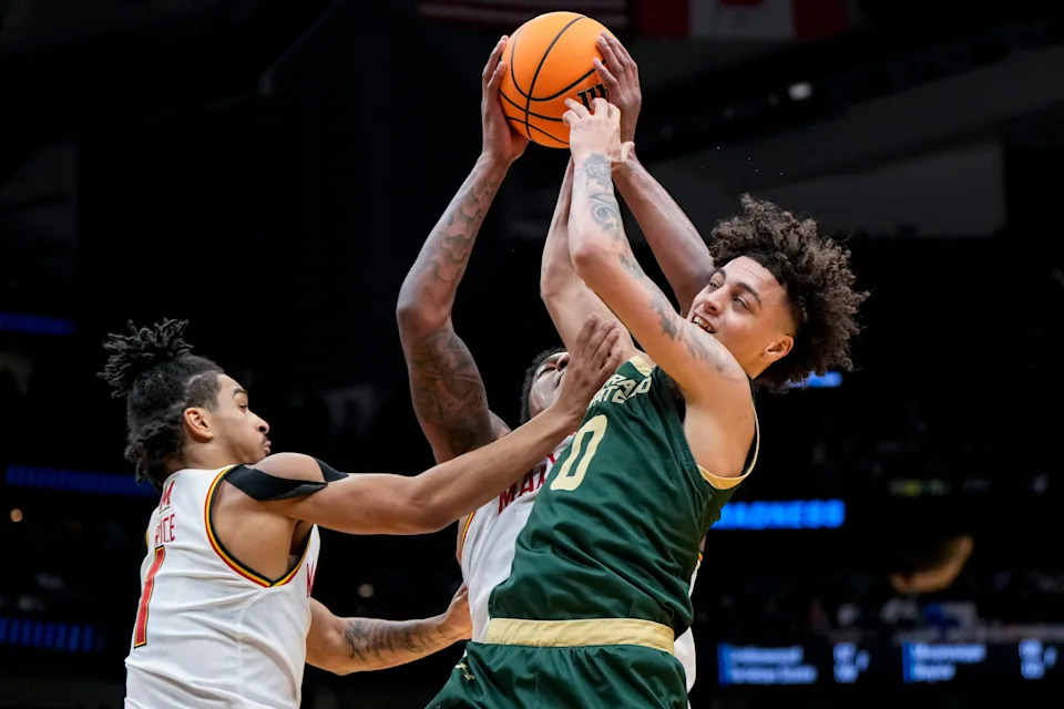 Mar 23, 2025; Seattle, WA, USA; Maryland Terrapins guard Rodney Rice (1) reacts as forward Julian Reese (10) battles for the ball against Colorado State Rams guard Kyan Evans (0) in the first half at Climate Pledge Arena. Mandatory Credit: Steven Bisig-Imagn Images