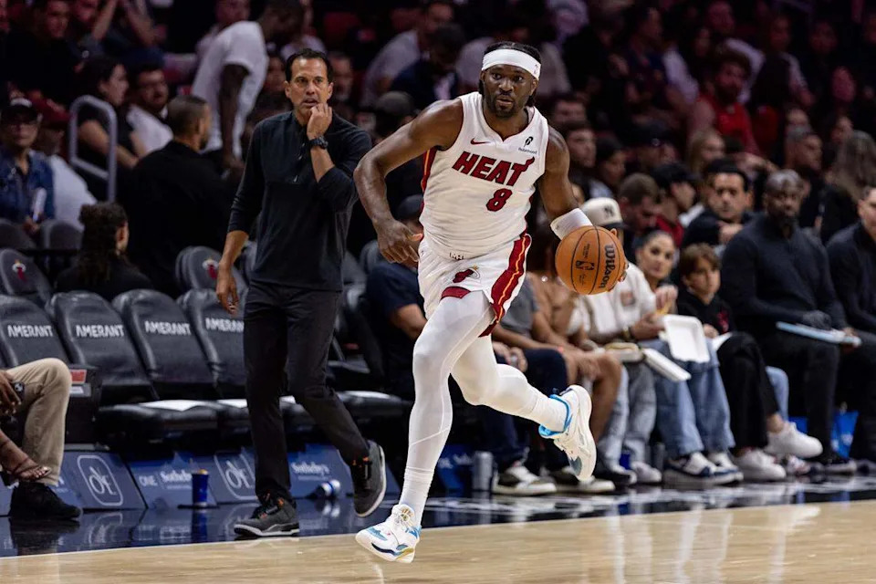 Miami Heat forward Precious Achiuwa (8) dribbles up court as Head Coach Erik Spoelstra looks on during an NBA preseason game against the Milwaukee Bucks at Kaseya Center on October 6, 2025, in Miami.