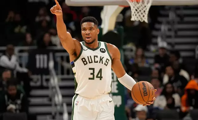 Milwaukee Bucks forward Giannis Antetokounmpo calls a play during the first half of a preseason NBA basketball game against the Oklahoma City Thunder on Tuesday, Oct. 14, 2025, in Milwaukee. (AP Photo/Kayla Wolf)