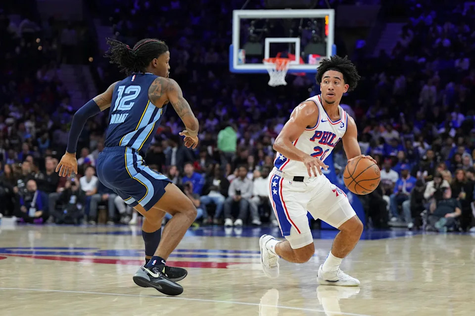 PHILADELPHIA, PENNSYLVANIA - NOVEMBER 2: Jared McCain #20 of the Philadelphia 76ers dribbles the ball against Ja Morant #12 of the Memphis Grizzlies in the second half at the Wells Fargo Center on November 2, 2024 in Philadelphia, Pennsylvania. The Grizzlies defeated the 76ers 124-107. NOTE TO USER: User expressly acknowledges and agrees that, by downloading and/or using this photograph, user is consenting to the terms and conditions of the Getty Images License Agreement. (Photo by Mitchell Leff/Getty Images)